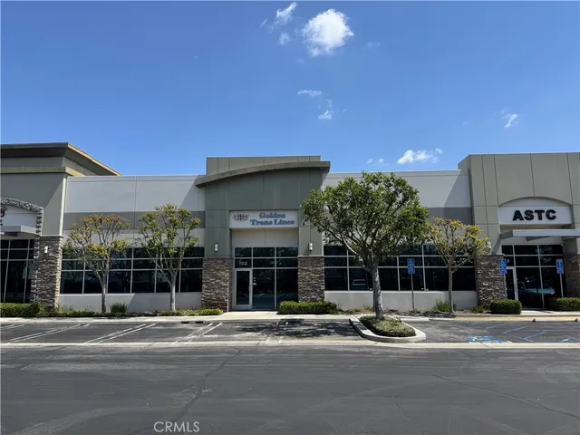 a view of a house with a yard and plants