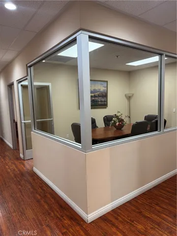 a view of a living room with wooden floor