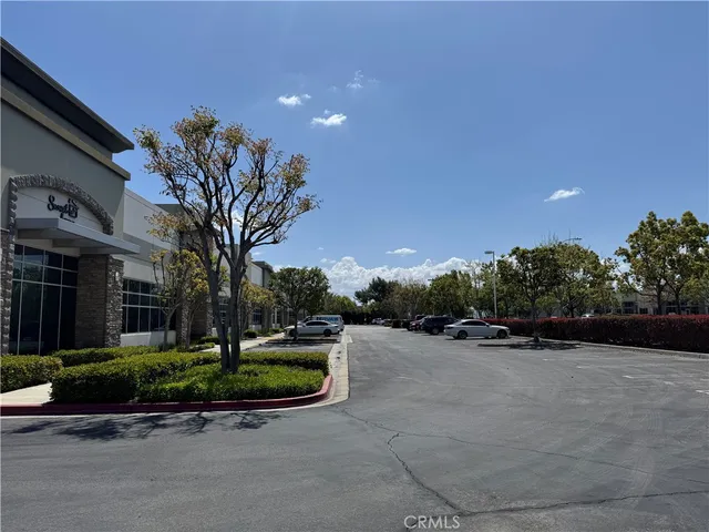 a front view of a house with a yard and a garage