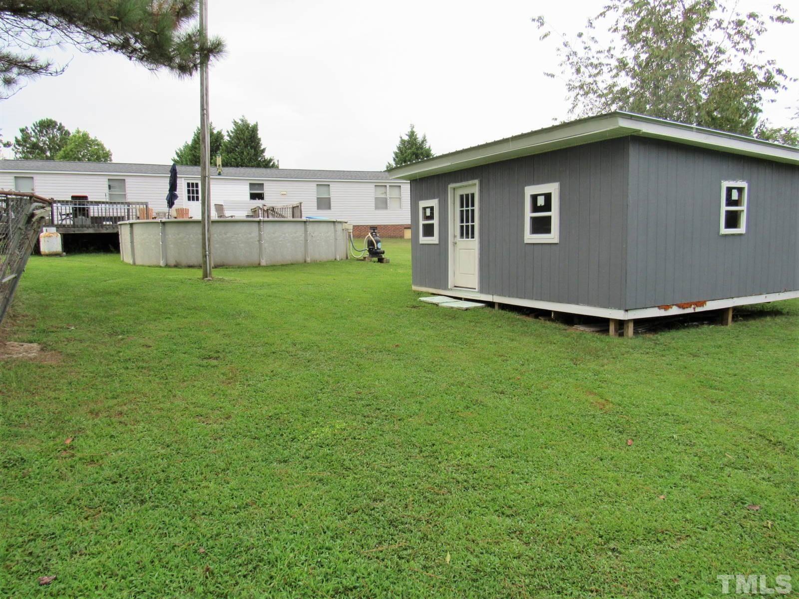 1198 Adams Mountain Road Stem, NC 27581 - Photo 12 of 19 a view of a house with backyard