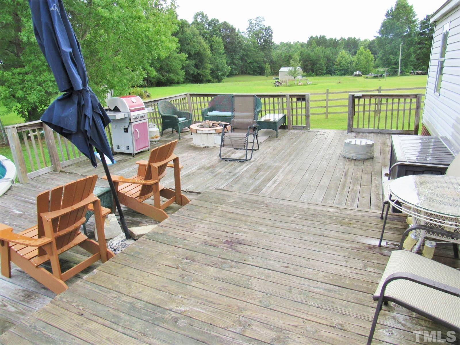 1198 Adams Mountain Road Stem, NC 27581 - Photo 10 of 19 an outdoor sitting area with furniture and garden