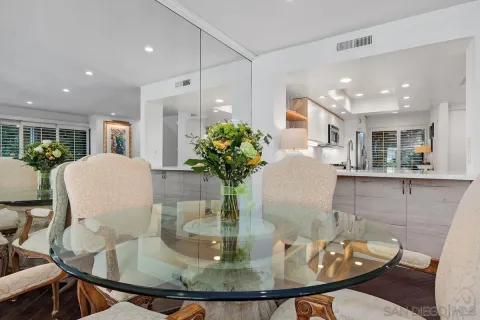 a kitchen with a sink and a mirror
