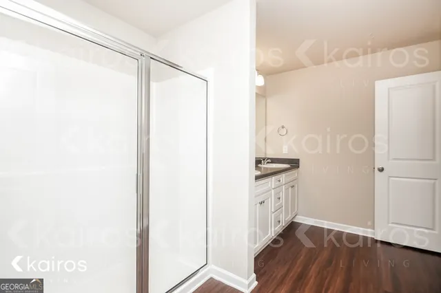 a kitchen with granite countertop a sink and a stove top oven