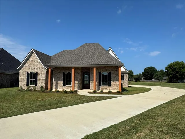 a view of a house with outdoor space and porch