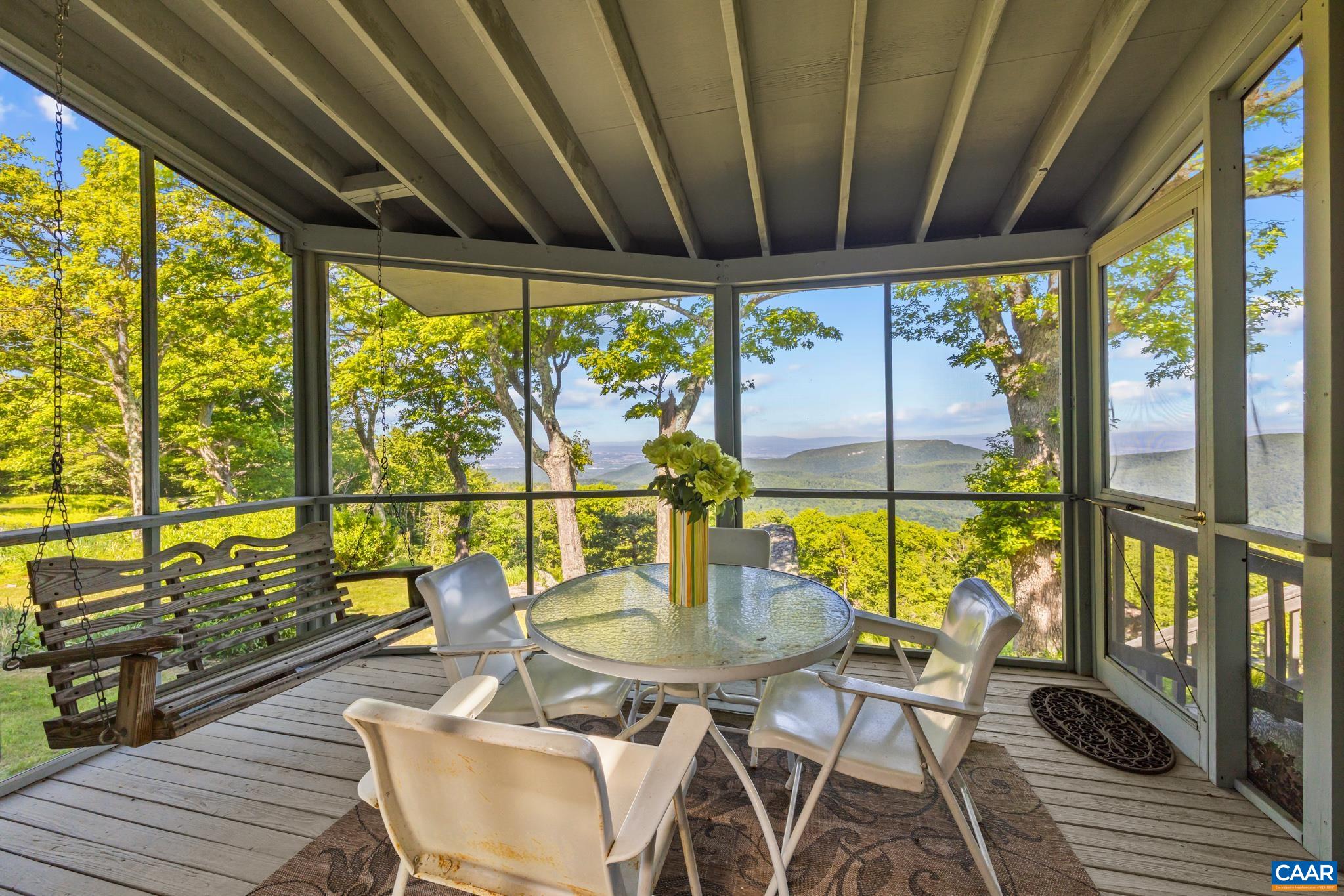 7098 Bucks Elbow Mountain Road Crozet, VA 22932 - Photo 35 of 57 a view of a dining room with furniture window and outside view