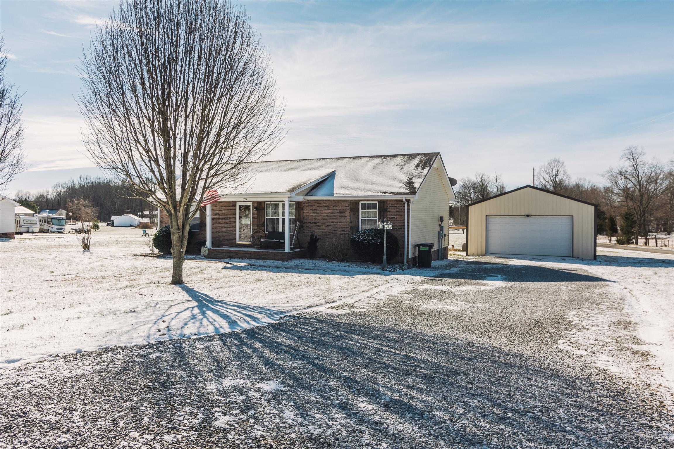 399 Corinth Road Portland, TN 37148 - Photo 26 of 28 a front view of a house with a yard and garage