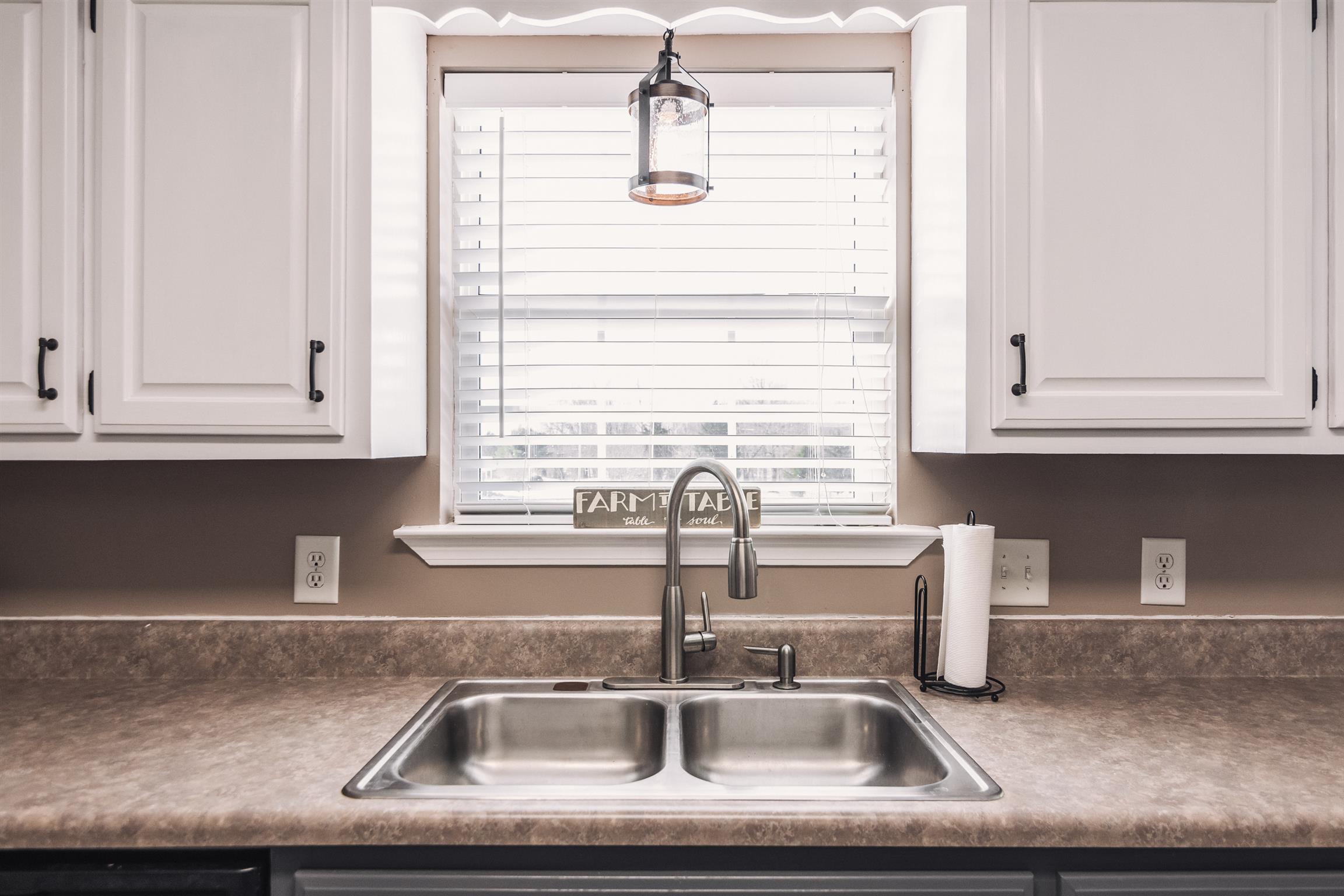 399 Corinth Road Portland, TN 37148 - Photo 9 of 28 a kitchen with a sink and cabinets