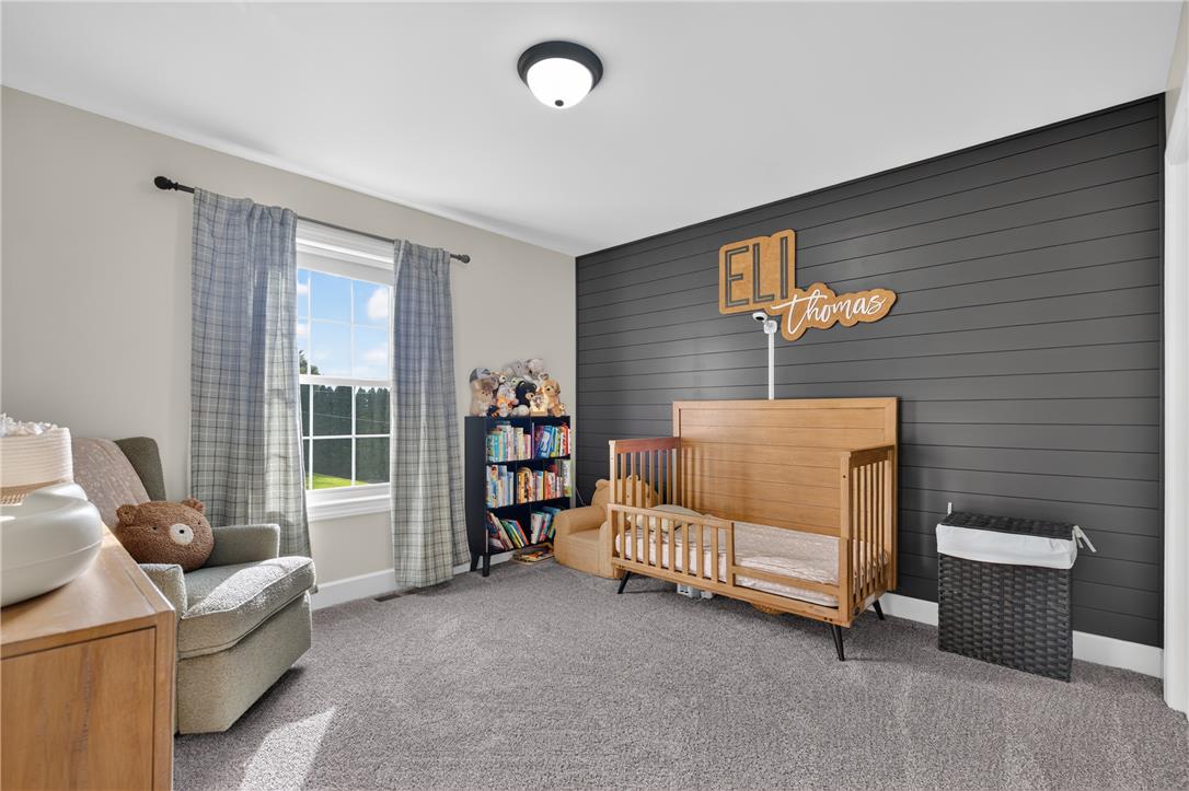 74 Kepners Road New Ringgold, PA 17960 - Photo 42 of 79 A single window illuminates the soft carpeting and custom horizontal paneling of this bedroom.