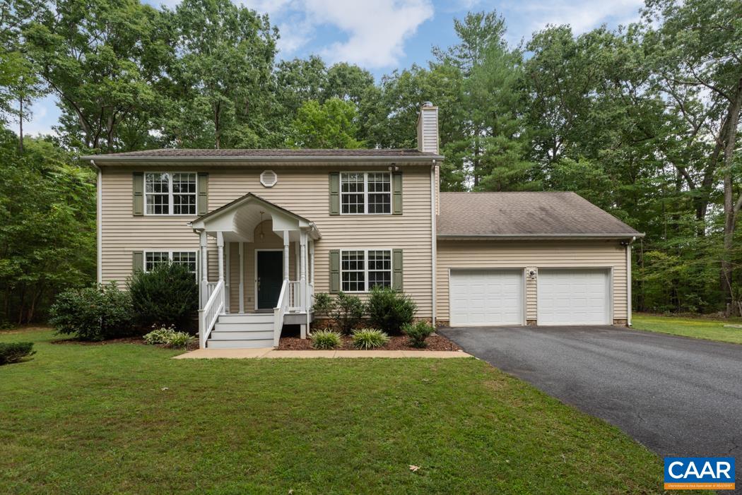 164 Wind Ridge Drive Ruckersville, VA 22968 - Photo 1 of 51 a front view of house with yard and green space