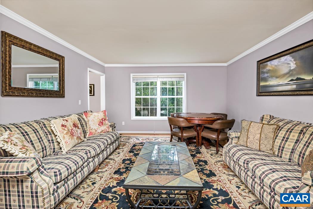 164 Wind Ridge Drive Ruckersville, VA 22968 - Photo 15 of 51 a living room with furniture and a large window