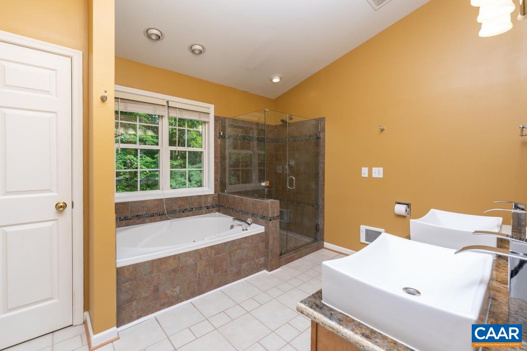 164 Wind Ridge Drive Ruckersville, VA 22968 - Photo 18 of 51 a bathroom with a bathtub and a sink