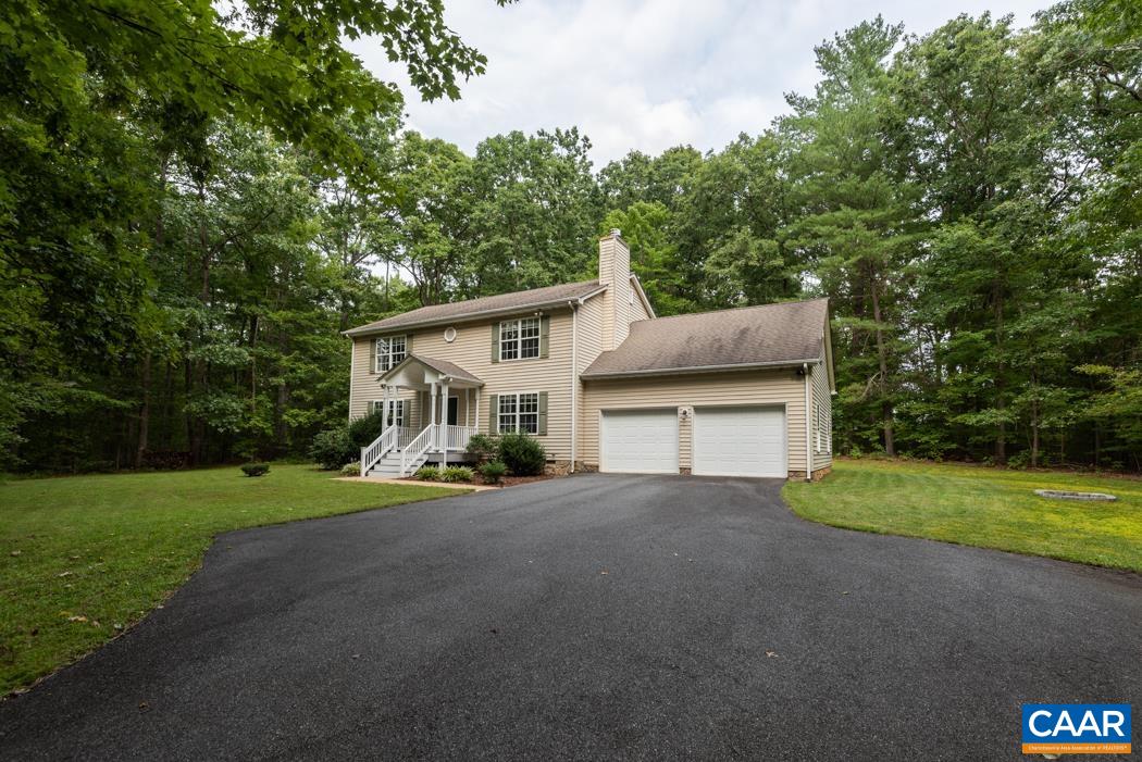 164 Wind Ridge Drive Ruckersville, VA 22968 - Photo 2 of 51 a view of a house with a yard and large trees