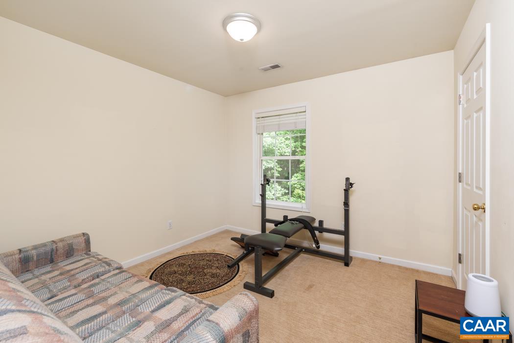 164 Wind Ridge Drive Ruckersville, VA 22968 - Photo 21 of 51 a bedroom with a bed and a window
