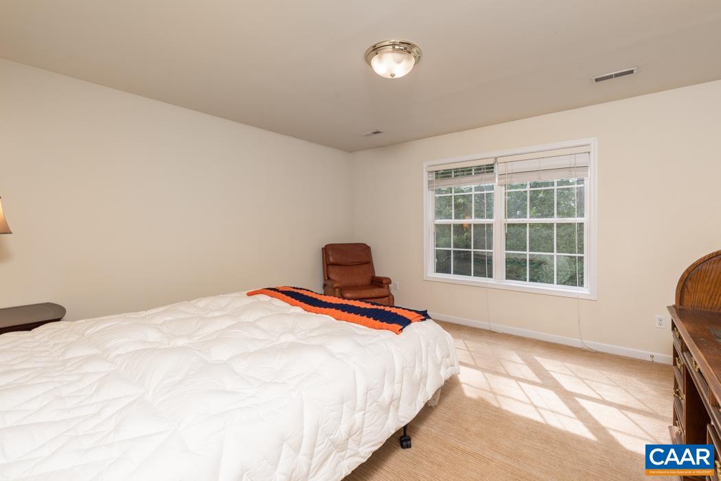 164 Wind Ridge Drive Ruckersville, VA 22968 - Photo 23 of 51 a bedroom with a bed and a large window