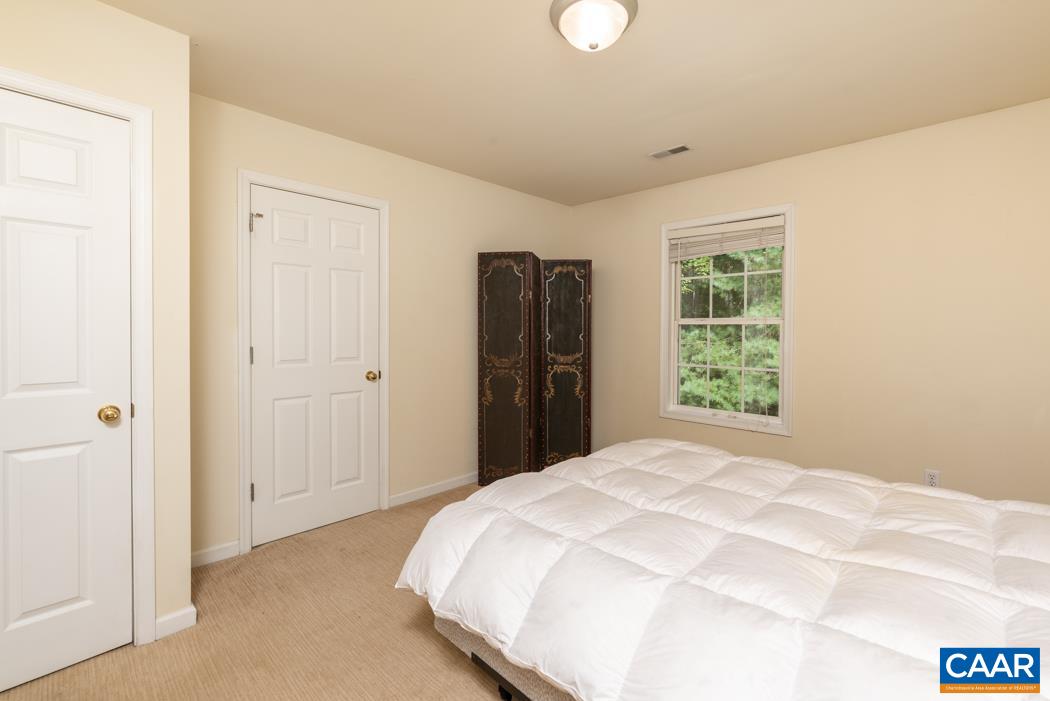 164 Wind Ridge Drive Ruckersville, VA 22968 - Photo 26 of 51 a bedroom with a bed and a window
