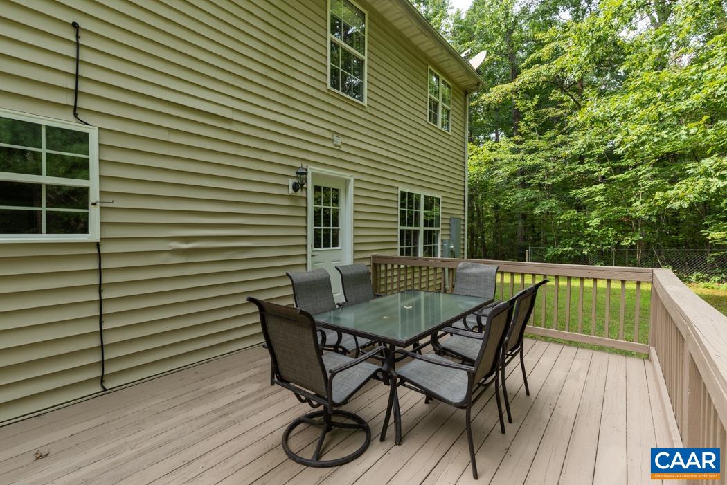 164 Wind Ridge Drive Ruckersville, VA 22968 - Photo 29 of 51 a balcony with table and chairs