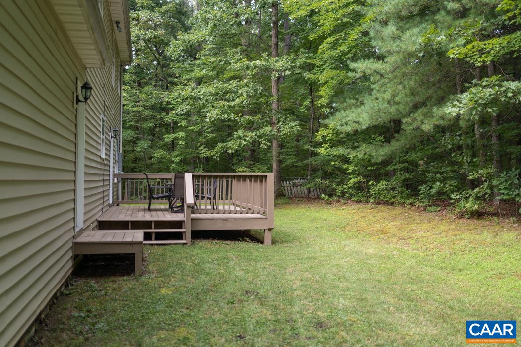 164 Wind Ridge Drive Ruckersville, VA 22968 - Photo 30 of 51 a view of a deck with a bench