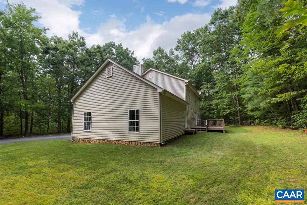 164 Wind Ridge Drive Ruckersville, VA 22968 - Photo 32 of 51 a view of a backyard with a garden