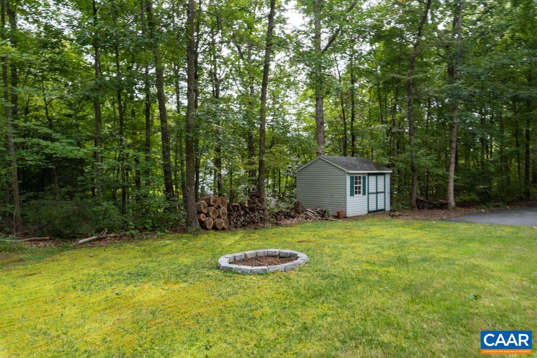 164 Wind Ridge Drive Ruckersville, VA 22968 - Photo 33 of 51 a view of a backyard with a garden