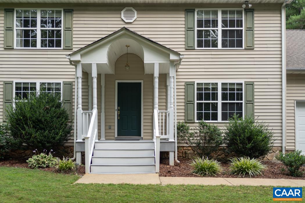 164 Wind Ridge Drive Ruckersville, VA 22968 - Photo 37 of 51 a front view of a house with a yard