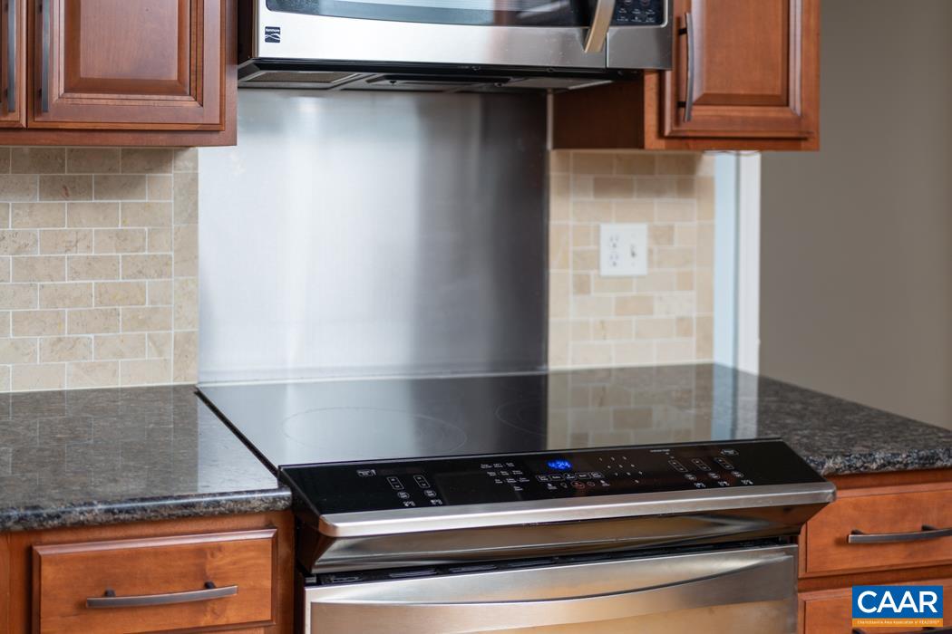 164 Wind Ridge Drive Ruckersville, VA 22968 - Photo 43 of 51 a stove top oven sitting inside of a kitchen