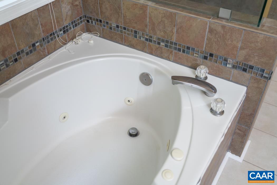 164 Wind Ridge Drive Ruckersville, VA 22968 - Photo 48 of 51 a bathroom with a sink and mirror