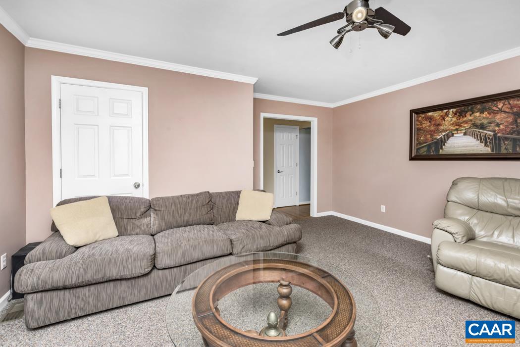 164 Wind Ridge Drive Ruckersville, VA 22968 - Photo 6 of 51 a living room with furniture and a couch