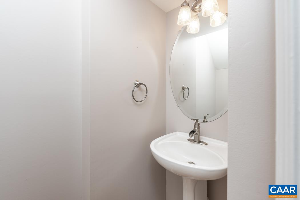 164 Wind Ridge Drive Ruckersville, VA 22968 - Photo 7 of 51 a bathroom with a sink and a mirror