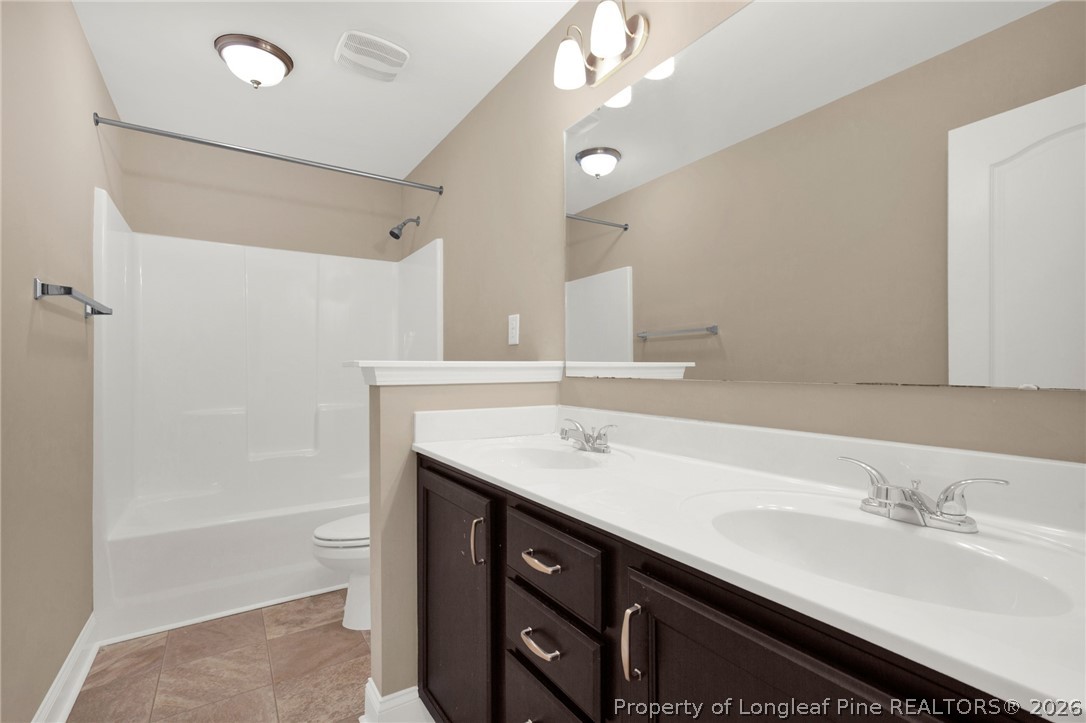 448 Pittfield Run Cameron, NC 28326 - Photo 25 of 43 a bathroom with a sink double vanity granite tub shower and a mirror