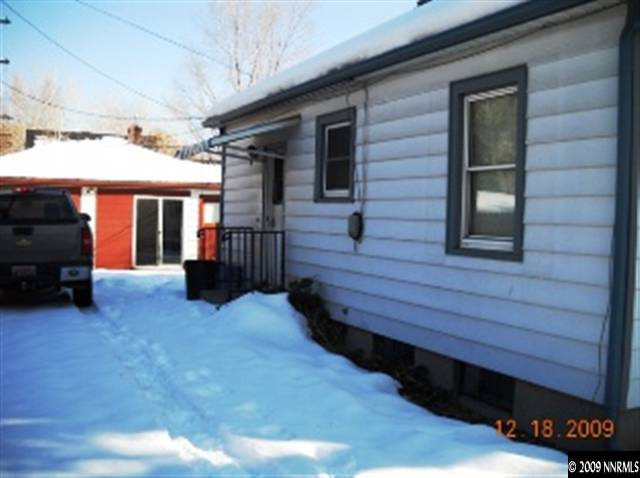 770 Vine Street Reno, NV 89503 - Photo 9 of 9 a view of a house with a barbeque and wooden stairs