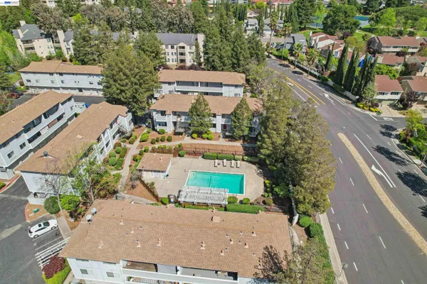 an aerial view of residential houses with outdoor space