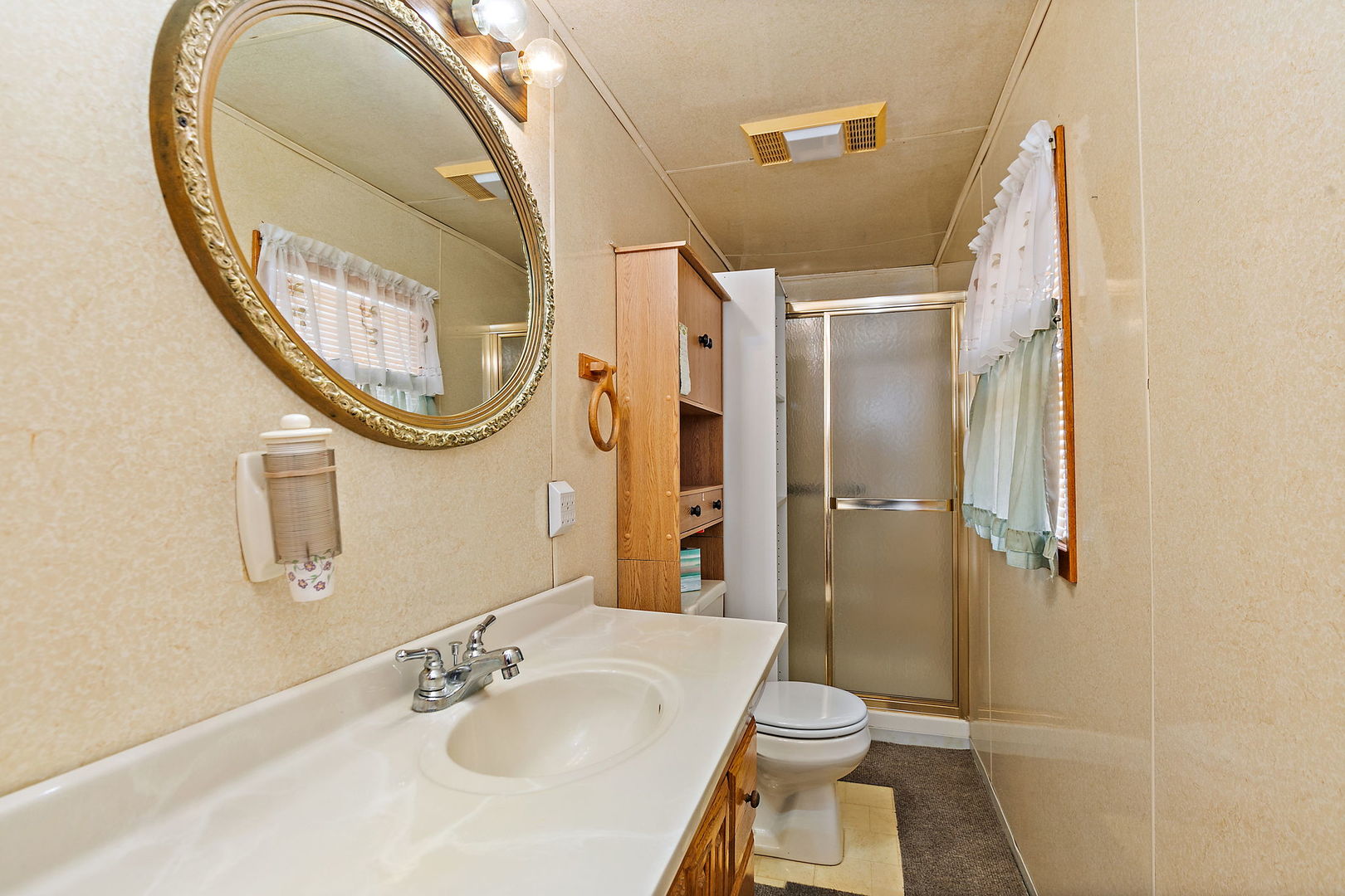 11824 Prairie Avenue Hebron, IL 60034 - Photo 12 of 22 a bathroom with a sink and a mirror