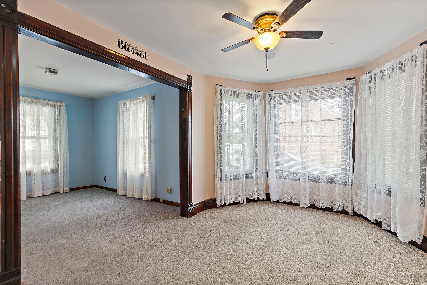 11824 Prairie Avenue Hebron, IL 60034 - Photo 7 of 22 a view of a livingroom with a chandelier fan and windows