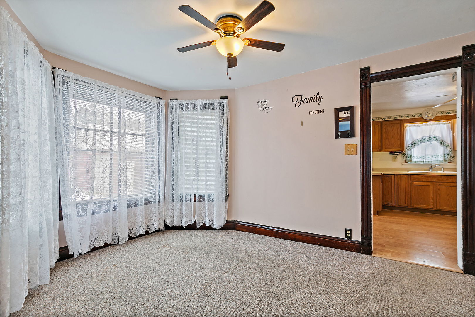 11824 Prairie Avenue Hebron, IL 60034 - Photo 8 of 22 a view of a livingroom with a ceiling fan and window