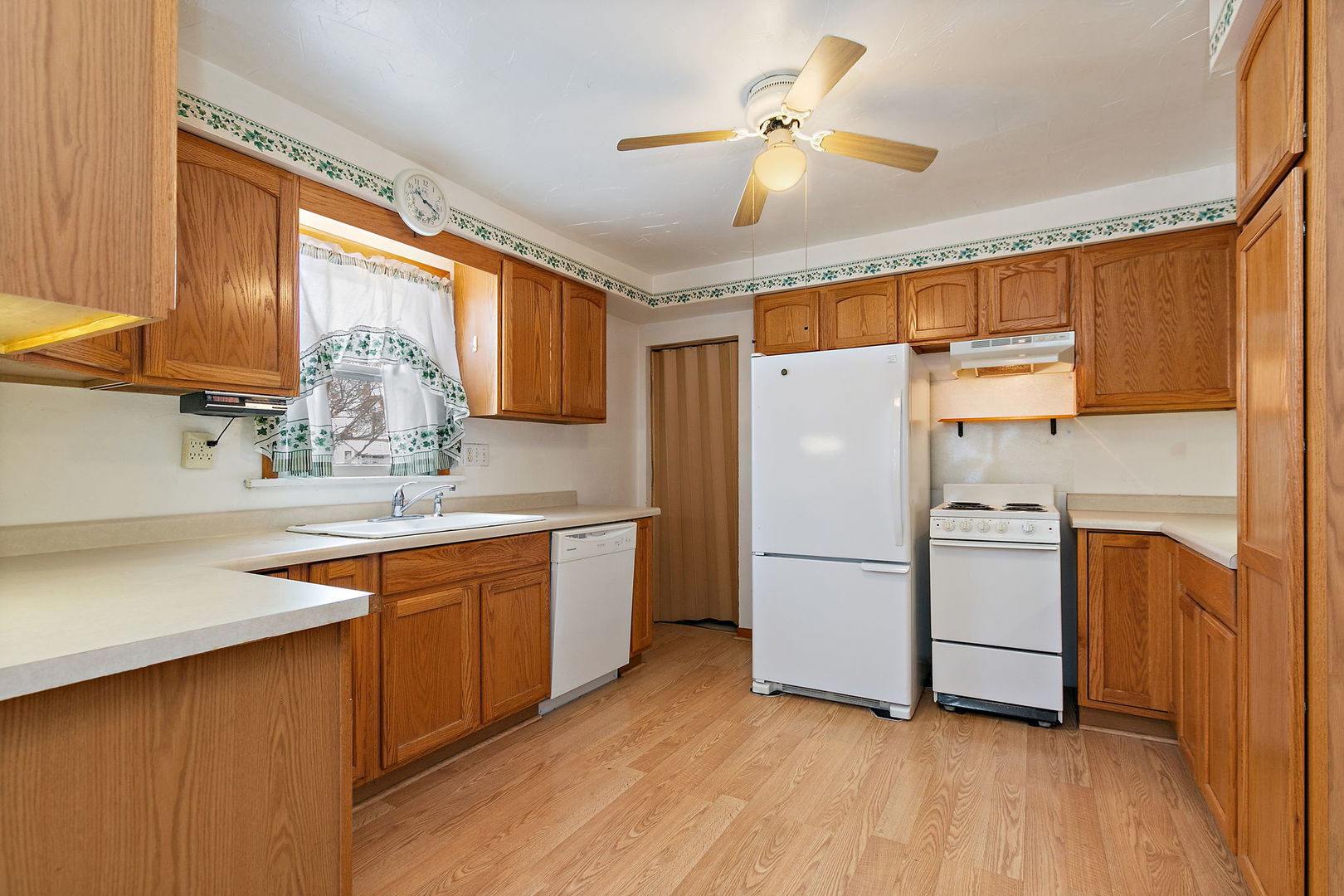 11824 Prairie Avenue Hebron, IL 60034 - Photo 9 of 22 a kitchen with stainless steel appliances a refrigerator a sink and white cabinets