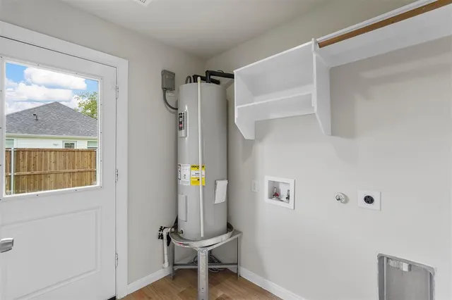 a bathroom with a window and a shower