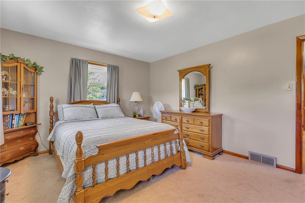 383 Ridgemont Drive Midland, PA 15059 - Photo 34 of 44 a bedroom with a bed and a dresser