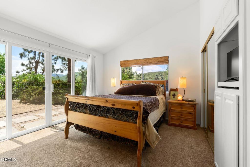 3907 United Road Agoura Hills, CA 91301 - Photo 14 of 34 a bed sitting in a bedroom next to a window