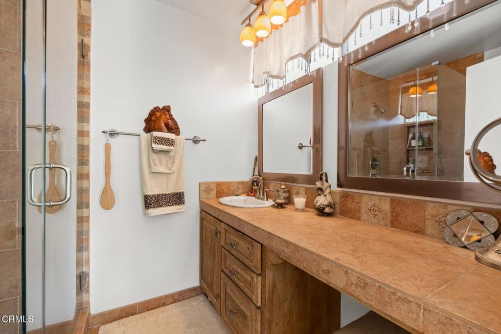 3907 United Road Agoura Hills, CA 91301 - Photo 16 of 34 a bathroom with a sink and a mirror