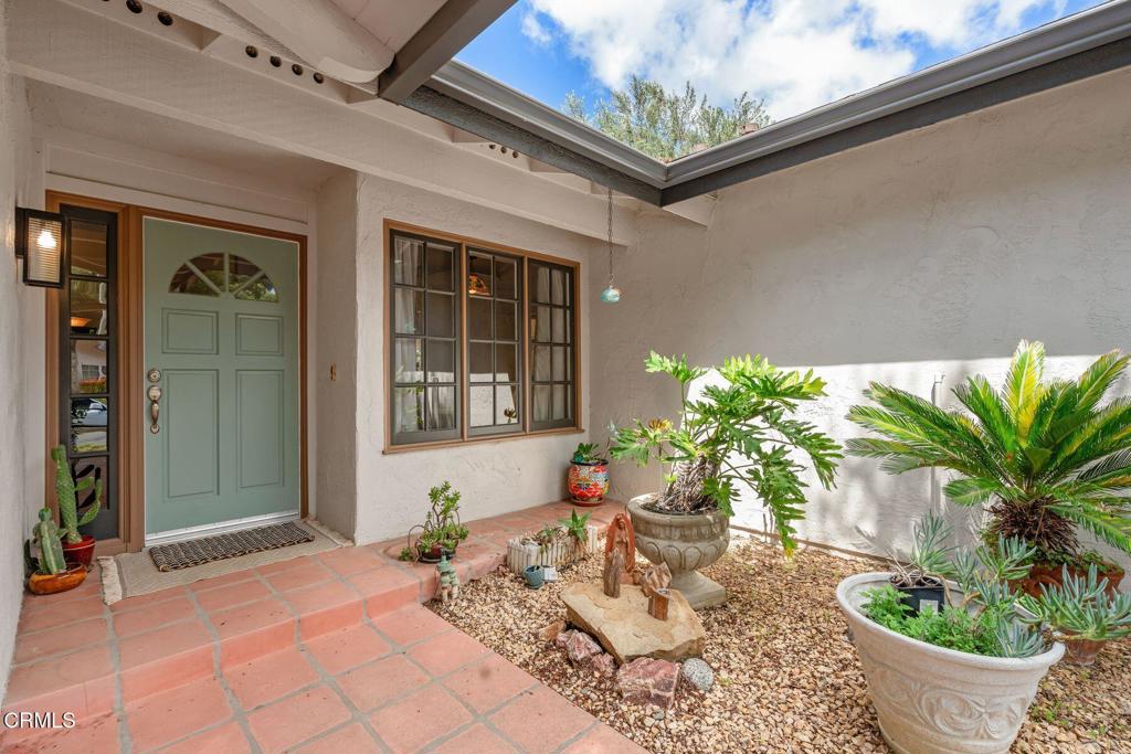 3907 United Road Agoura Hills, CA 91301 - Photo 4 of 34 a potted plant sitting in front of a window