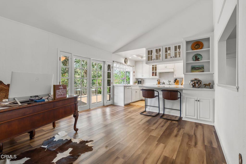 3907 United Road Agoura Hills, CA 91301 - Photo 8 of 34 a work room with furniture and a wooden floor