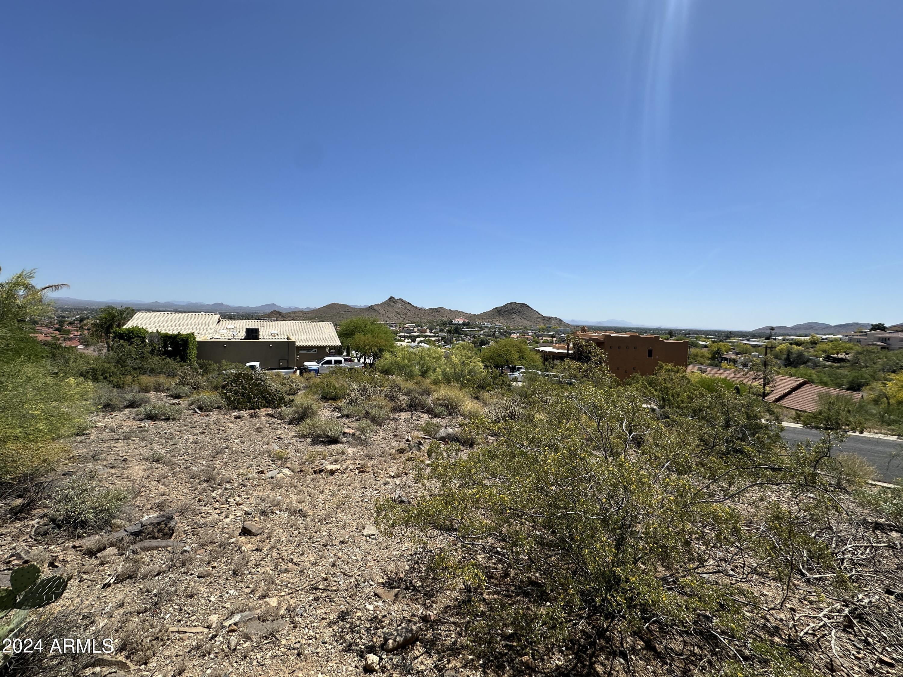 1702 East Calle Santa Cruz, Unit 29 Phoenix, AZ 85022 - Photo 8 of 15 a view of a large building with a city view