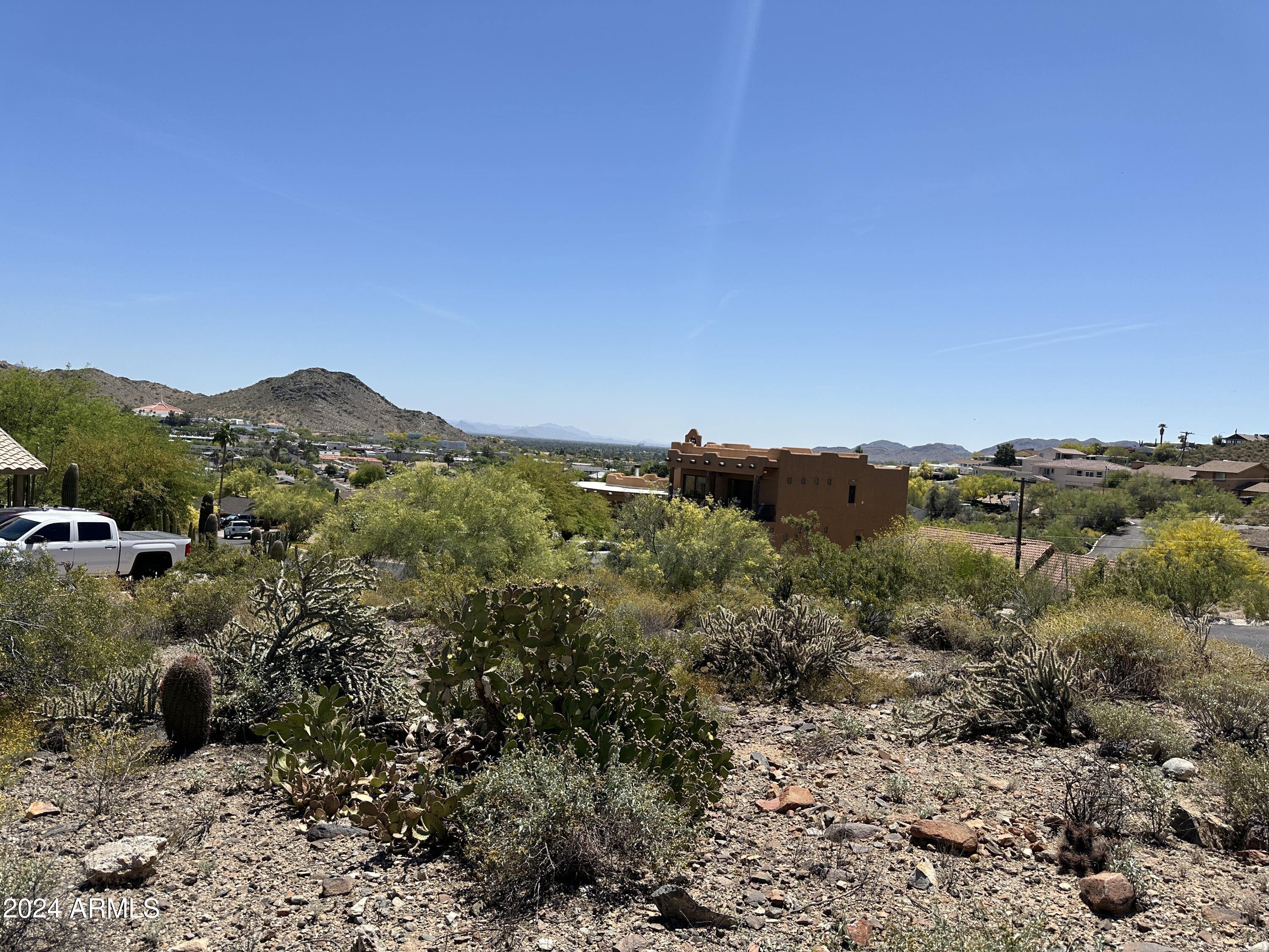 1702 East Calle Santa Cruz, Unit 29 Phoenix, AZ 85022 - Photo 10 of 15 a view of a forest with mountains in the background