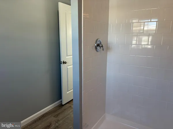 a bathroom with a toilet sink and window