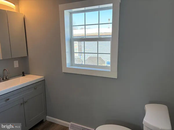 a bathroom with a sink and shower