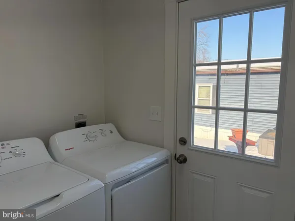 a bathroom with a granite countertop shower