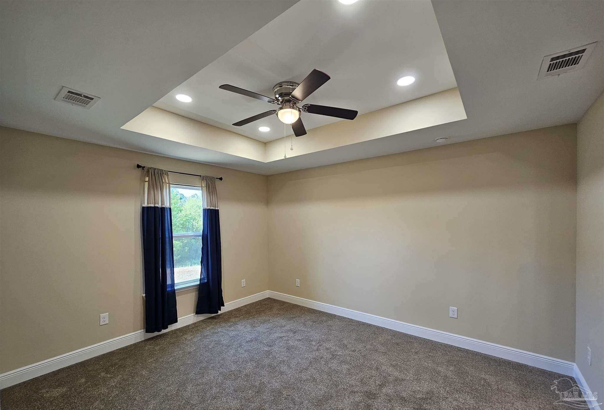 295 West Kingsfield Road Cantonment, FL 32533 - Photo 20 of 32 an empty room with closet and a chandelier fan