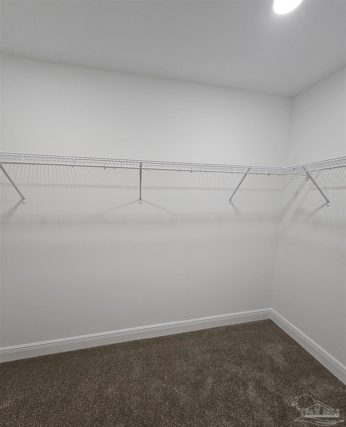295 West Kingsfield Road Cantonment, FL 32533 - Photo 27 of 32 a view of a room with racks on the wall