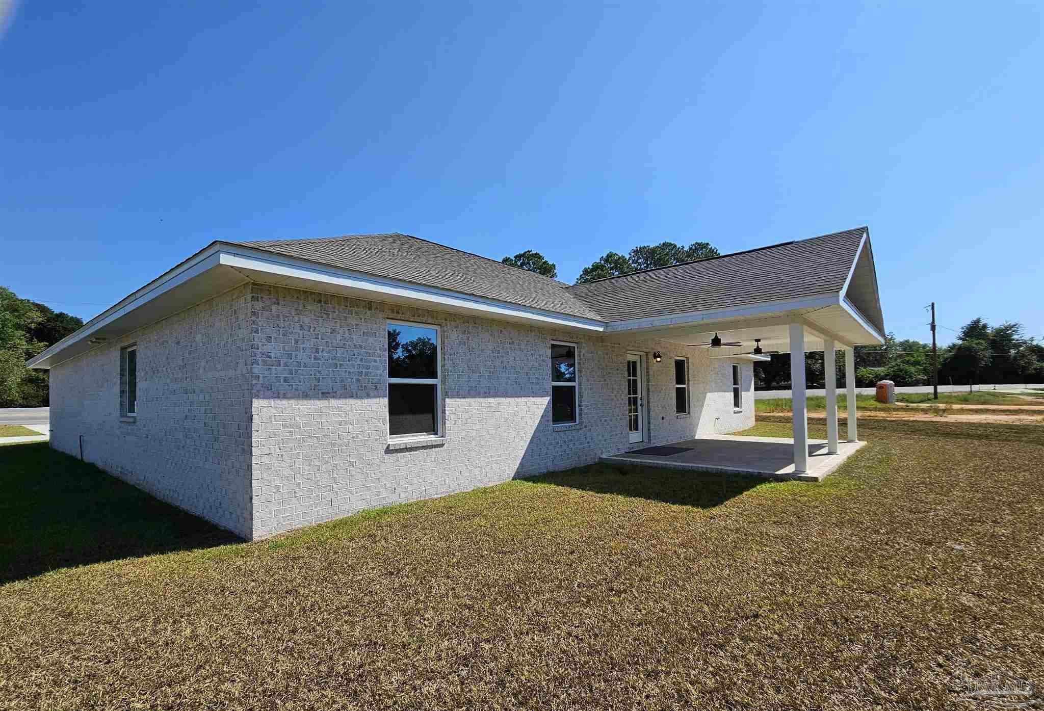 295 West Kingsfield Road Cantonment, FL 32533 - Photo 31 of 32 a front view of a house with a yard