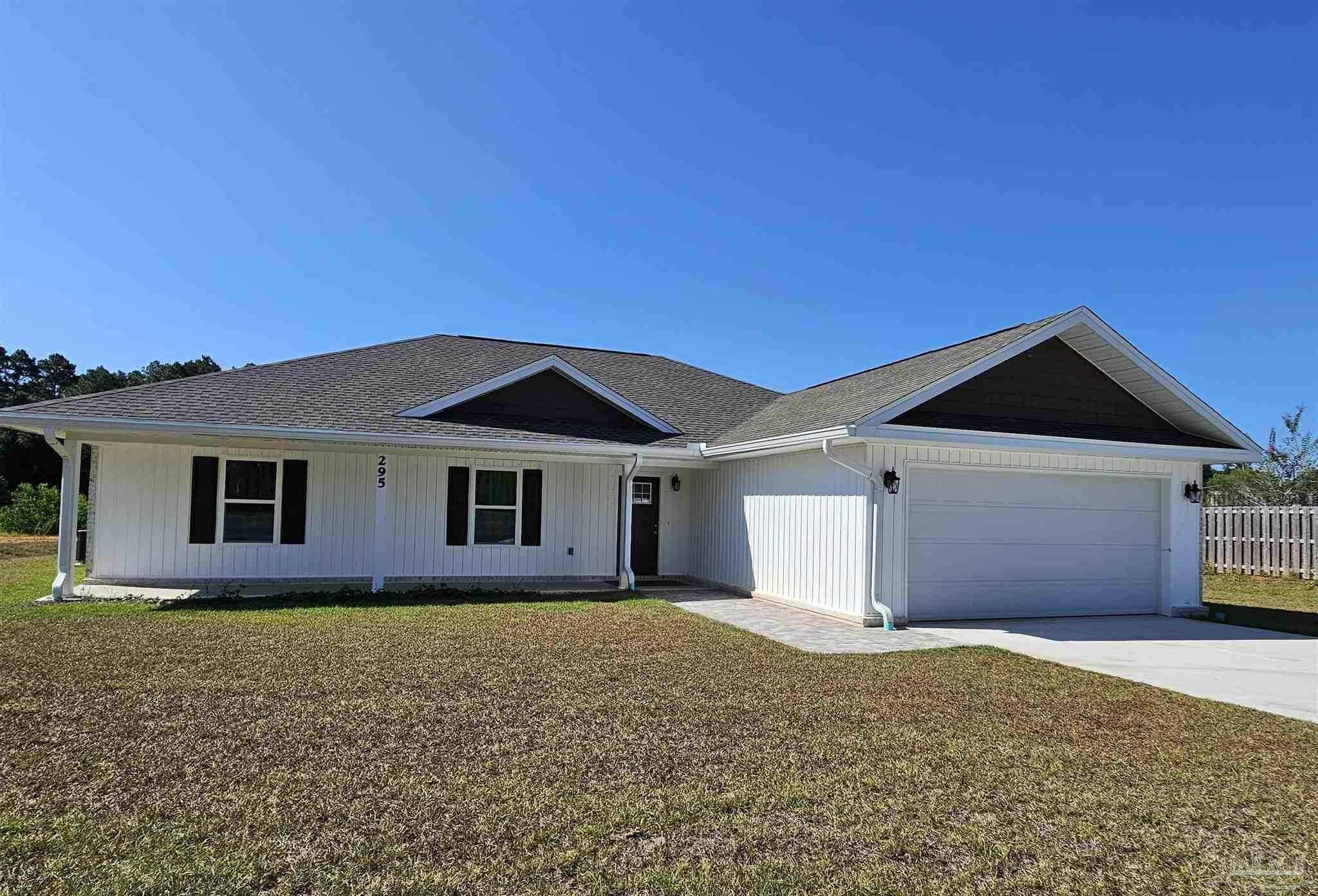 295 West Kingsfield Road Cantonment, FL 32533 - Photo 4 of 32 a front view of a house with a yard